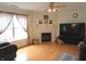 Spacious living room with a fireplace, hardwood floors, and large windows at 1217 Legacy Ln, Indianapolis, IN 46234