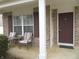 Cozy front porch with chairs; a welcoming entrance for relaxing and enjoying the neighborhood views at 1217 Legacy Ln, Indianapolis, IN 46234