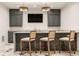 Modern basement bar with a marble countertop and sleek cabinetry at 1561 N Park Ave, Indianapolis, IN 46202