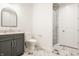 Basement bathroom with a walk-in shower and modern vanity at 1561 N Park Ave, Indianapolis, IN 46202