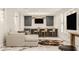 Finished basement with wet bar, seating area, and large TV at 1561 N Park Ave, Indianapolis, IN 46202