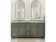 Double vanity bathroom with dark green cabinets and marble counters at 1561 N Park Ave, Indianapolis, IN 46202