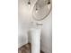 Stylish powder room featuring a pedestal sink and unique lighting at 1561 N Park Ave, Indianapolis, IN 46202