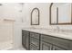 Elegant bathroom with double vanity, frameless shower, and marble tile at 1561 N Park Ave, Indianapolis, IN 46202