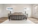 Bright bedroom with metal bed frame and hardwood floors at 1561 N Park Ave, Indianapolis, IN 46202