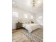Bright bedroom with hardwood floors, a large bed and chandelier at 1561 N Park Ave, Indianapolis, IN 46202