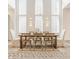 Dining area with wooden table, cross-back chairs, and large windows at 1561 N Park Ave, Indianapolis, IN 46202