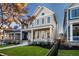 Two-story house with gray siding, black fence, and landscaping at 1561 N Park Ave, Indianapolis, IN 46202