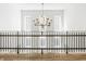 Open hallway showcasing a stunning chandelier and hardwood floors at 1561 N Park Ave, Indianapolis, IN 46202