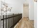 Bright hallway with hardwood floors and an ornate chandelier at 1561 N Park Ave, Indianapolis, IN 46202