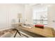 Home office with a wooden desk and view to the upper floor at 1561 N Park Ave, Indianapolis, IN 46202