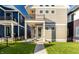 Tan house with a balcony, backyard, and walkway at 1561 N Park Ave, Indianapolis, IN 46202