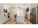 Modern kitchen with light cabinets, marble island, stainless steel appliances, and hardwood floors at 1561 N Park Ave, Indianapolis, IN 46202