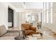 Open living area with brown leather armchair and view of dining area at 1561 N Park Ave, Indianapolis, IN 46202