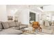 Open living room with sectional sofa, armchair, and view into dining area at 1561 N Park Ave, Indianapolis, IN 46202