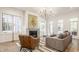 Spacious living room with fireplace, chandelier, and large windows at 1561 N Park Ave, Indianapolis, IN 46202