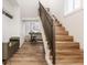 Modern staircase with metal railing and hardwood treads at 1561 N Park Ave, Indianapolis, IN 46202