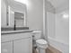 Bright bathroom features a white vanity with modern fixtures and a shower-tub combination at 16956 Cattle Hollow Ln, Noblesville, IN 46060