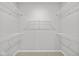 White wire shelving throughout this walk-in closet ensures an organized storage solution at 16956 Cattle Hollow Ln, Noblesville, IN 46060