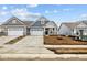Charming two-story home featuring a two-car garage, and a well-manicured lawn, perfect for comfortable living at 16956 Cattle Hollow Ln, Noblesville, IN 46060