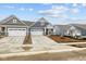 Charming two-story home featuring a two-car garage, and a well-manicured lawn, perfect for comfortable living at 16956 Cattle Hollow Ln, Noblesville, IN 46060