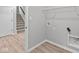 Functional laundry room with hookups and storage space near the stairs at 16956 Cattle Hollow Ln, Noblesville, IN 46060