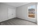 Neutral bedroom, featuring large window and double closet doors at 16964 Cattle Hollow Ln, Noblesville, IN 46060