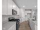 Bright, modern kitchen featuring an island, gas range, stainless steel appliances, and white cabinets at 16964 Cattle Hollow Ln, Noblesville, IN 46060