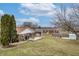 Spacious backyard featuring a patio, grill, fire pit, and lush lawn for outdoor enjoyment at 2338 Malibu Ct, Anderson, IN 46012