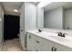 Bright bathroom featuring a double vanity with modern faucets, and a shower with a black curtain at 2338 Malibu Ct, Anderson, IN 46012