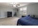 Bedroom with blue bedding, window with blinds, ceiling fan, and carpeted flooring at 2338 Malibu Ct, Anderson, IN 46012