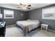 Bedroom with carpeted flooring, neutral colored paint, and two windows with blinds at 2338 Malibu Ct, Anderson, IN 46012