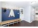 Mud room area with a wooden bench, coat hooks, and access to kitchen at 2338 Malibu Ct, Anderson, IN 46012