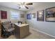 Bright office space with a large desk, comfortable chair, and decor celebrating sports teams at 2338 Malibu Ct, Anderson, IN 46012