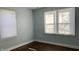 Light blue walls and hardwood floors in bedroom at 302 E Cowing Dr, Muncie, IN 47303