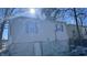 Rear view of house with partial basement exposure at 302 E Cowing Dr, Muncie, IN 47303