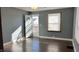 Gray walls and hardwood floors in the living room at 302 E Cowing Dr, Muncie, IN 47303