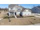 Two-story house with gray siding and a large backyard at 4416 Voyageur Way, Carmel, IN 46074