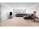 Finished basement with L-shaped sectional sofa at 4416 Voyageur Way, Carmel, IN 46074