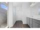 Modern bathroom with double vanity, gray cabinets, and a large walk-in shower at 4416 Voyageur Way, Carmel, IN 46074