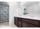Bathroom with double vanity, dark brown cabinets, and shower/tub combo at 4416 Voyageur Way, Carmel, IN 46074