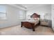 Bright bedroom with carpeted floor, double bed, and two nightstands at 4416 Voyageur Way, Carmel, IN 46074