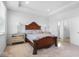 Spacious bedroom with a queen bed, ensuite bathroom access, and carpet flooring at 4416 Voyageur Way, Carmel, IN 46074
