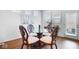 Charming breakfast nook featuring a round glass table and four chairs at 4416 Voyageur Way, Carmel, IN 46074