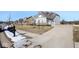 House exterior showcasing driveway and landscaping at 4416 Voyageur Way, Carmel, IN 46074