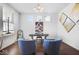 Bright home office with two chairs and a mirrored desk at 4416 Voyageur Way, Carmel, IN 46074