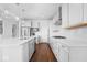 Modern kitchen with white cabinets, quartz countertops, and stainless steel appliances at 4416 Voyageur Way, Carmel, IN 46074