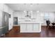 Modern kitchen with white cabinets, quartz countertops, and stainless steel appliances at 4416 Voyageur Way, Carmel, IN 46074