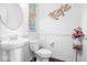 Clean powder room with pedestal sink and decorative accents at 4416 Voyageur Way, Carmel, IN 46074