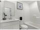 Clean bathroom with white vanity, bathtub, and tile at 5904 Sunstone Rd, Indianapolis, IN 46239